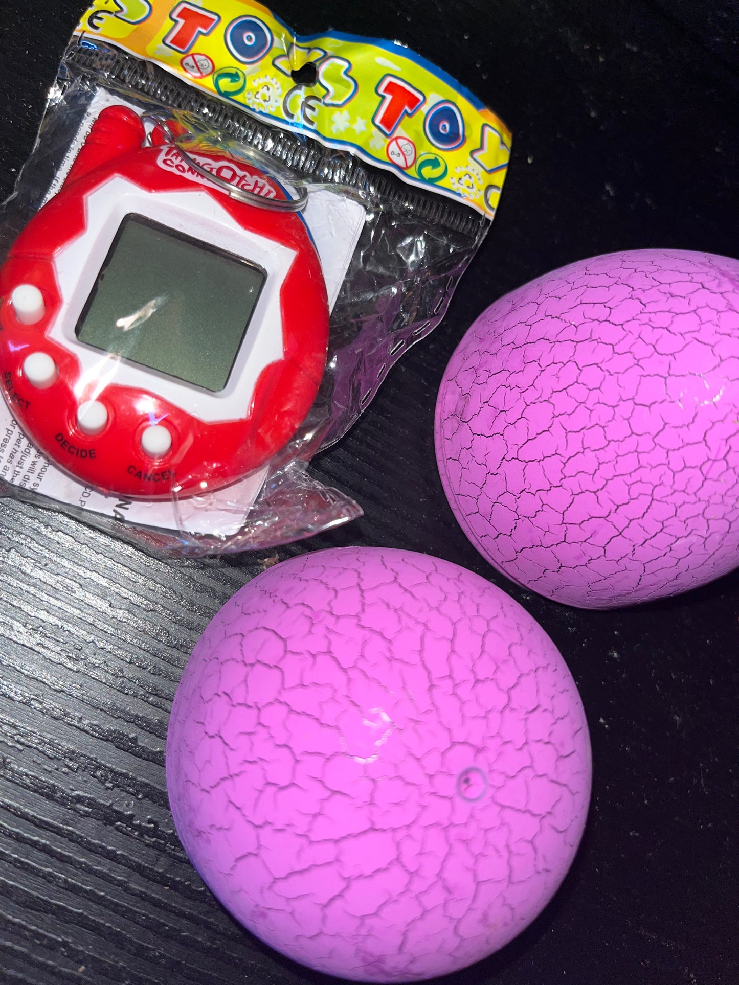 Tamagotchi Toy Tumblers In Dinosaur Egg (Game)